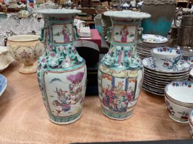 Pair of 19th century Chinese famille rose baluster vases painted with battle scenes