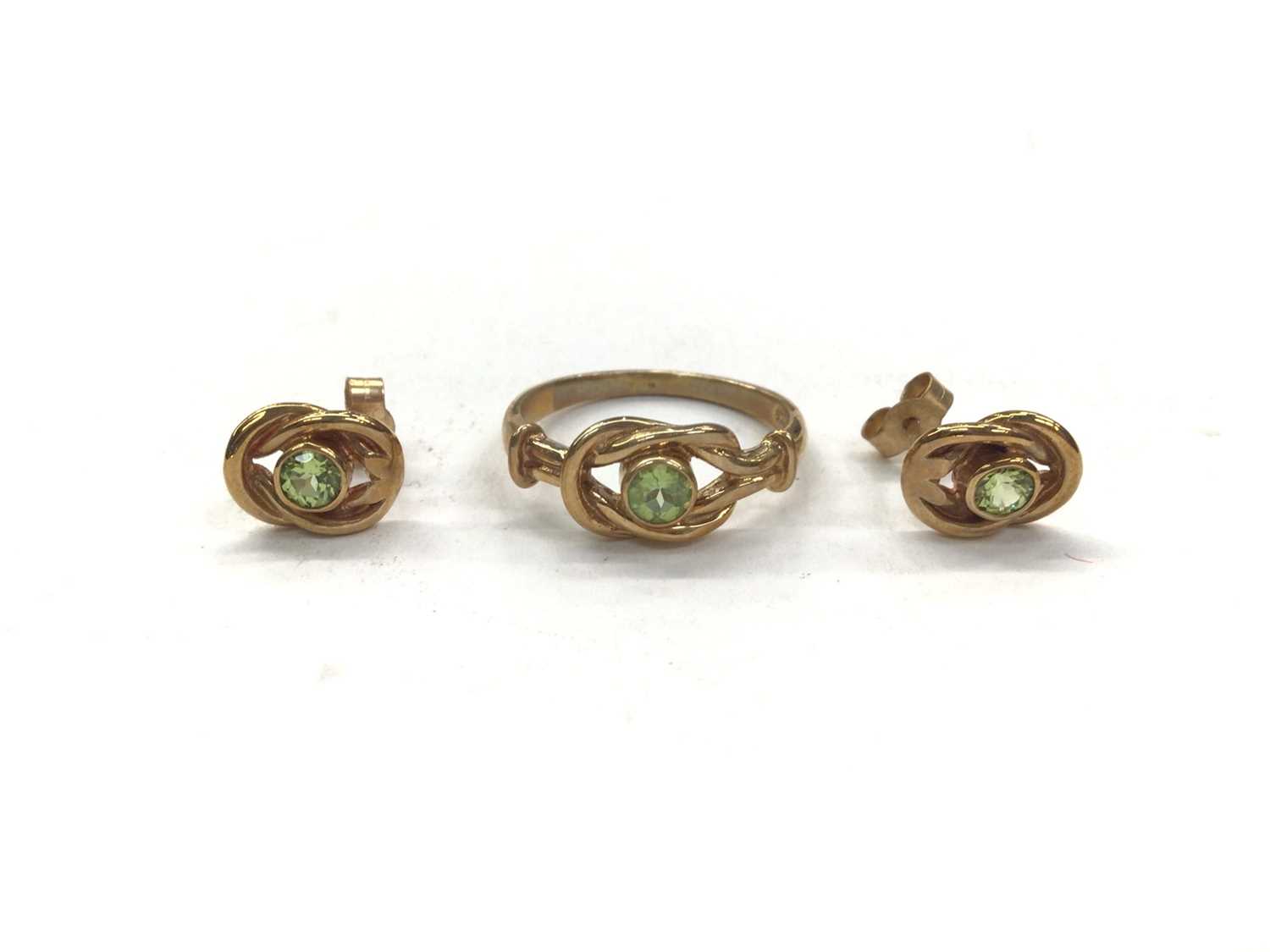 9ct gold peridot knot ring and pair of matching stud earrings