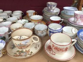 Large collection of moustache cups and saucers