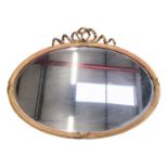 Louis XVI style oval giltwood and gesso wall mirror