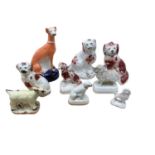 Group of 19th century Staffordshire animals, including a miniature poodle, a pug, a ram, etc, togeth