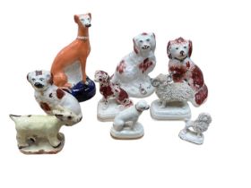 Group of 19th century Staffordshire animals, including a miniature poodle, a pug, a ram, etc, togeth