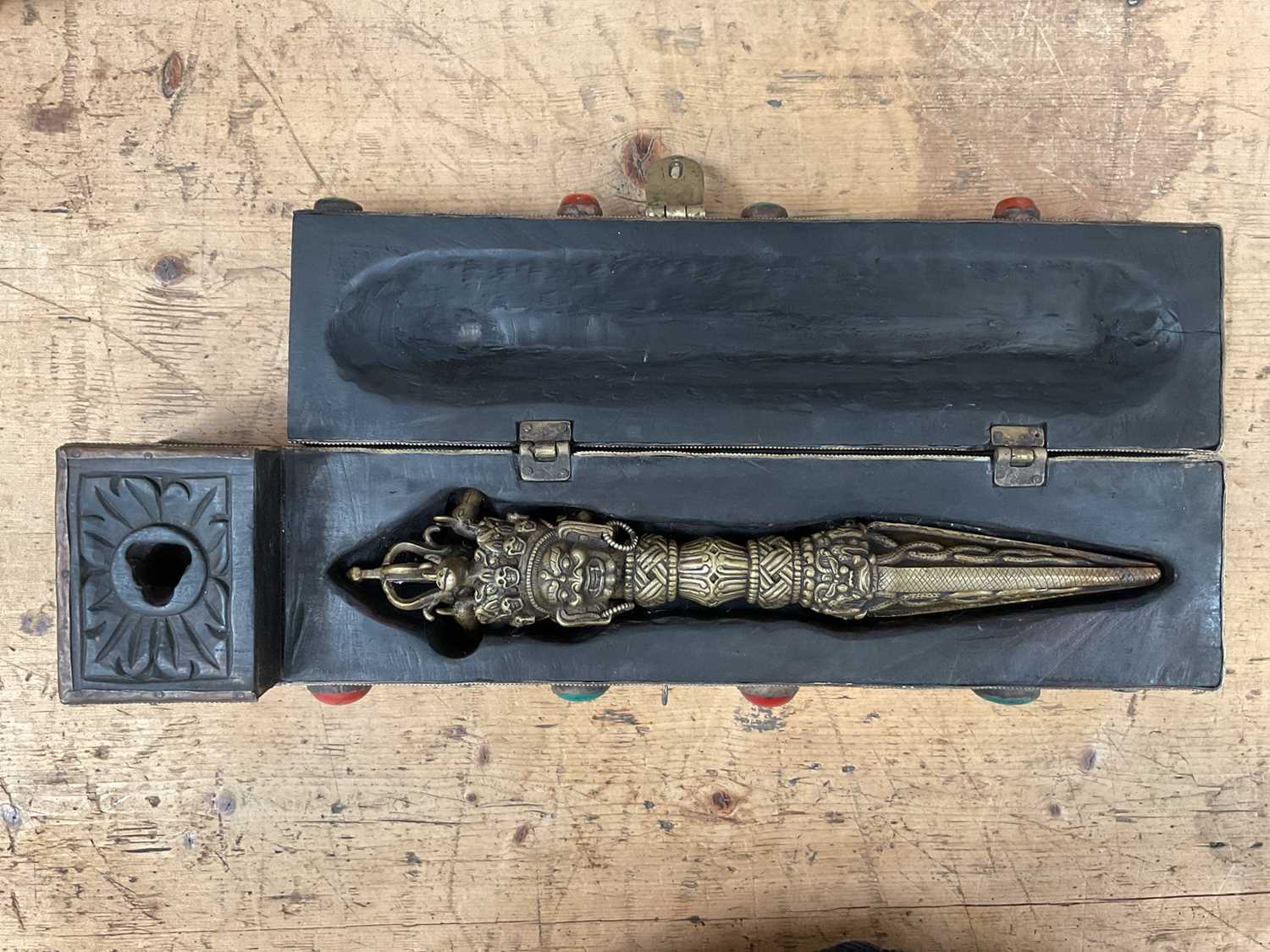 Tibetan ritual dagger/Phurba in fitted carved wooden case/stand with applied decoration, the case 48