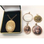 9ct gold oval locket on 9ct gold chain, three 9ct gold mounted glass lockets and a gold plated coin