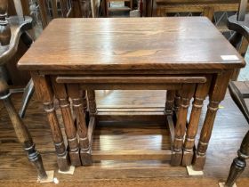 Oak nest of three occasional tables, together with a hanging cabinet (2)