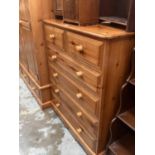 Modern pine chest of two short and four long drawers with bun handles 102cm wide, 131cm high