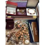 Wooden jewellery box containing costume jewellery, pair of silver cufflinks, silver ingot pendant on