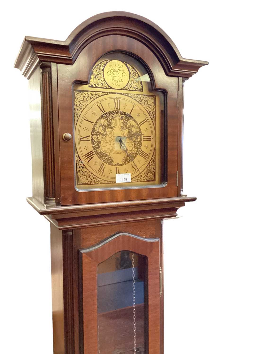 Reproduction mahogany longcase clock with pendulum and two brass weights