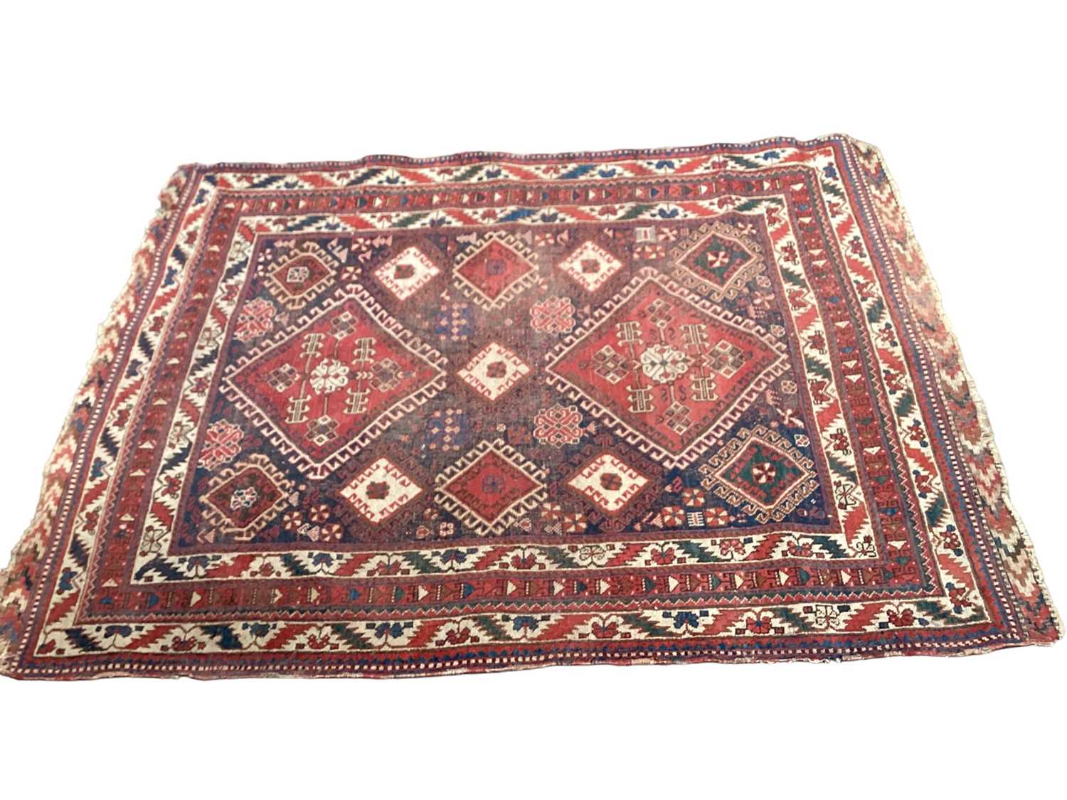 Two Eastern rugs with geometric decoration on red and blue ground, 175cm x 128cm