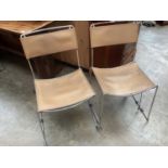 Set four Italian Mid Century-style dining chairs with chrome frames and leather seats and backs