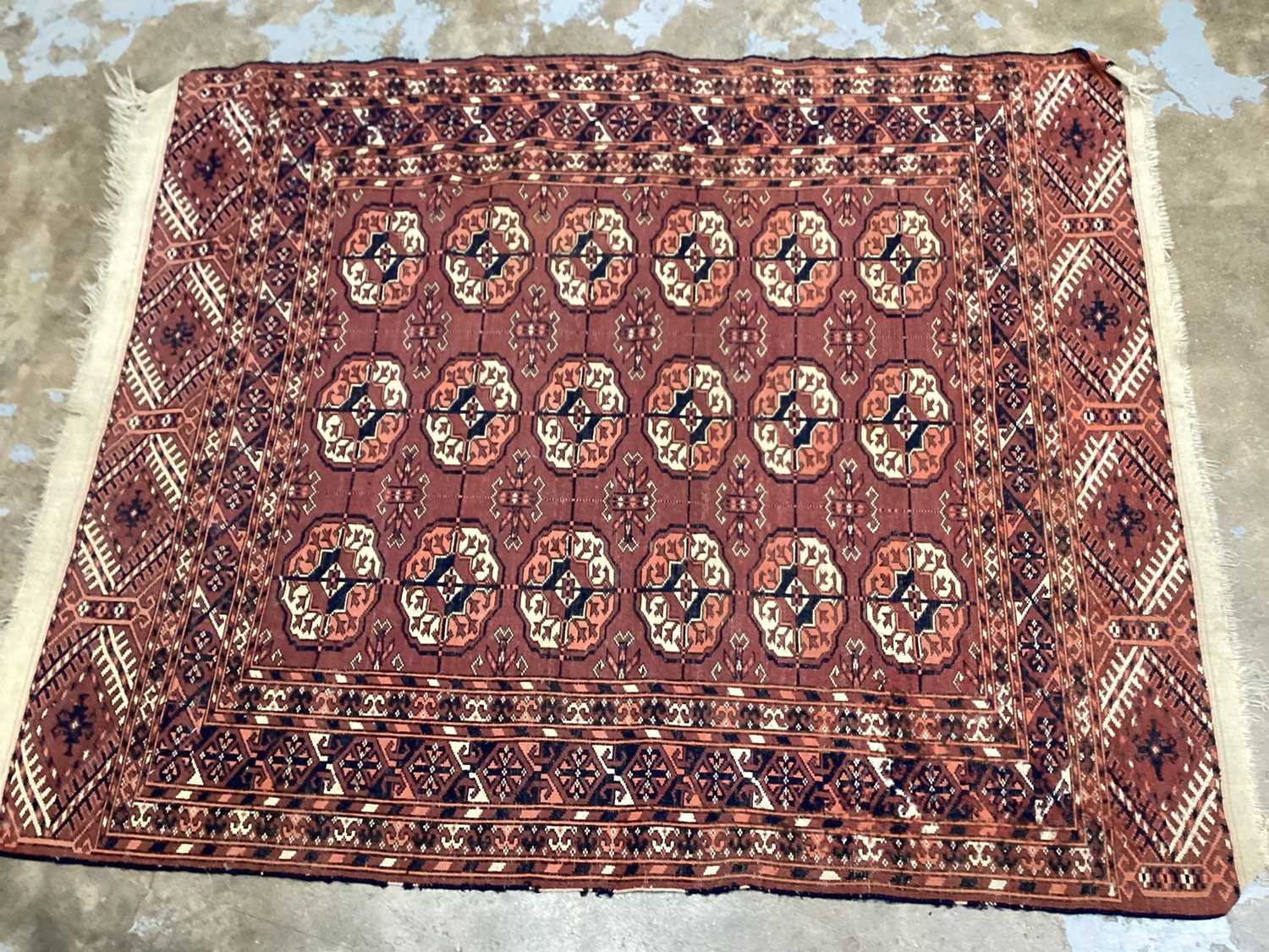 Eastern rug with sixteen central medallions on red and blue ground, 129cm x 103cm - Image 3 of 3