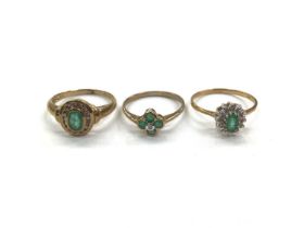 Three 9ct gold emerald and diamond set rings