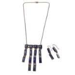 White metal and blue stone fringe pendant necklace and pair of matching earrings