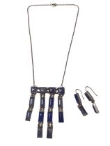 White metal and blue stone fringe pendant necklace and pair of matching earrings