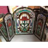 Stained glass triptych fire screen, gilt framed wall mirror and two other mirrors (4)
