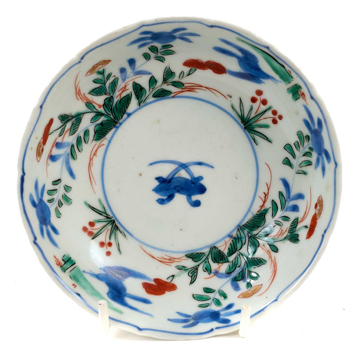 Japanese Arita saucer, circa 1690-1740, polychrome painted with flowers, four-character mark to base