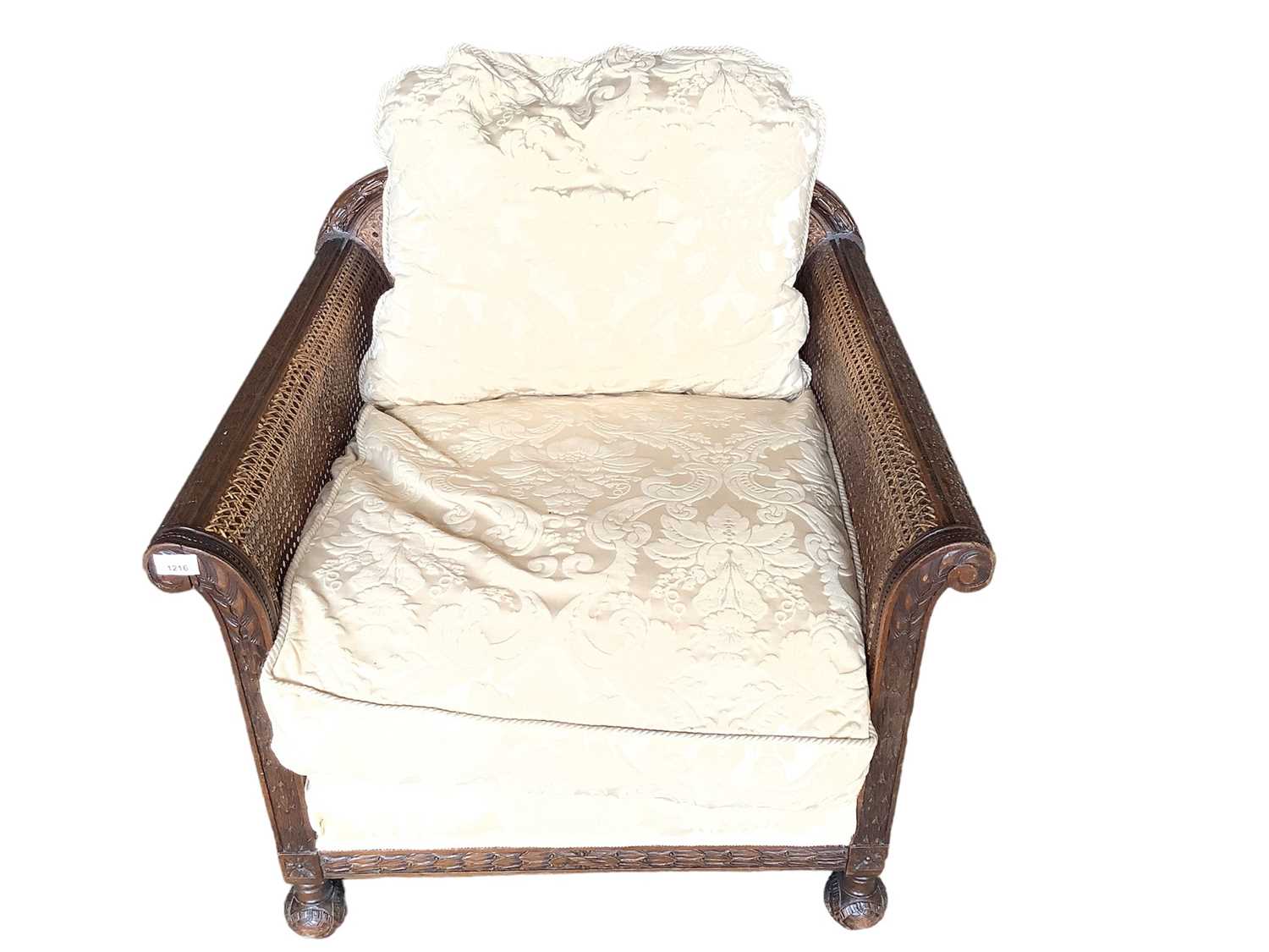 Early 20th century carved and caned bergere armchair