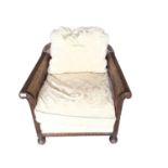 Early 20th century carved and caned bergere armchair