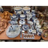 Group of various blue and white ceramics to include jugs, toast rack and dishes.