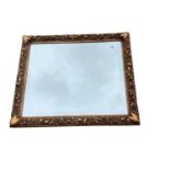 Gilt framed wall mirror in ornate frame, 53cm x 64cm