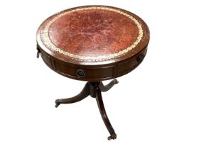 Reproduction mahogany drum table with inset leather lined top, together with a similar sofa table wi