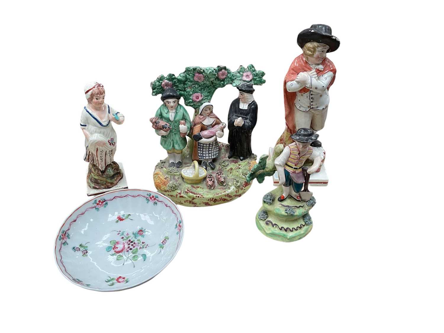 Group of Staffordshire figures, including a Tithe Pig group and three pearlware figures, and an 18th