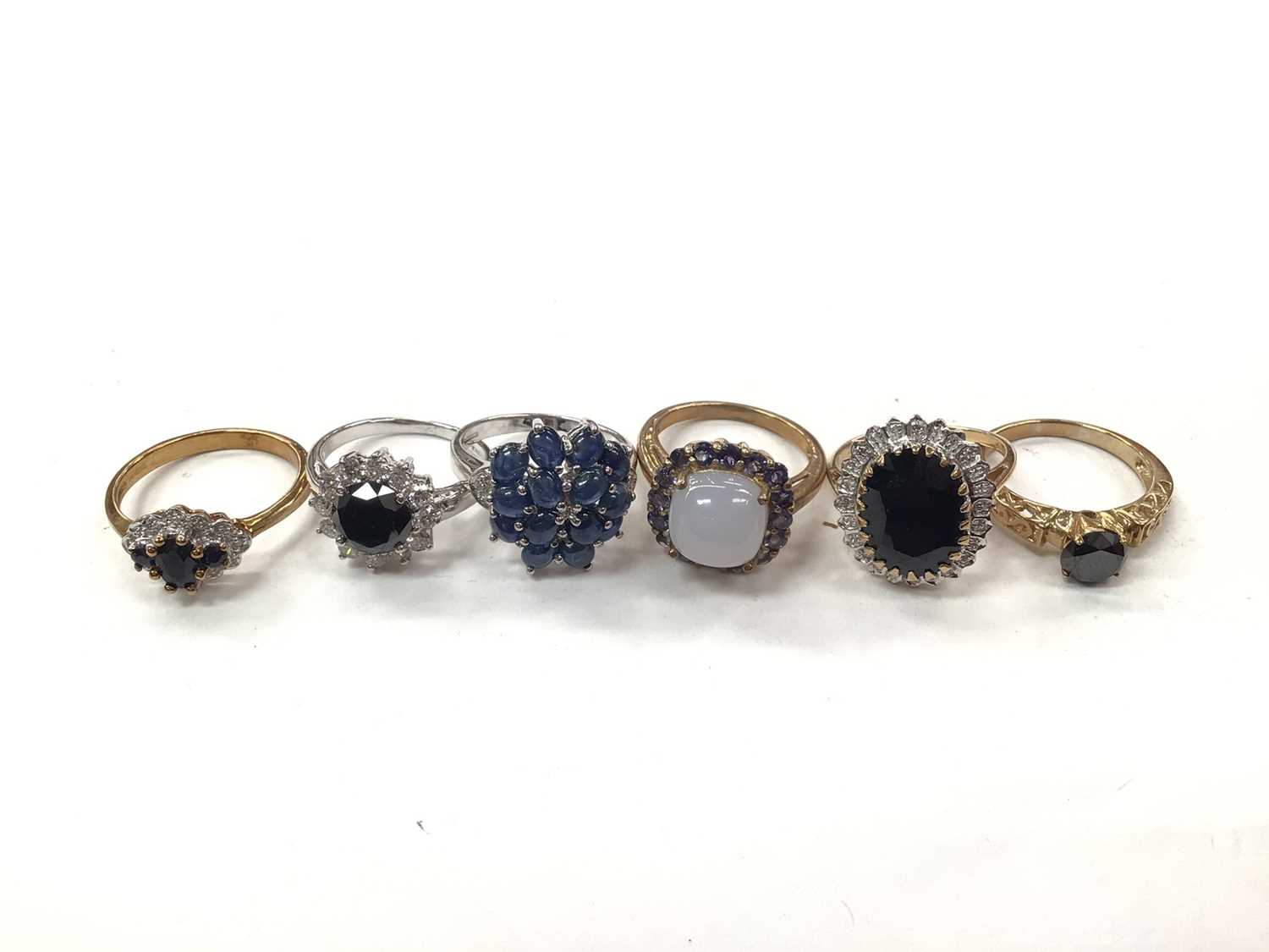 Six 9ct gold blue stone and gem set dress rings