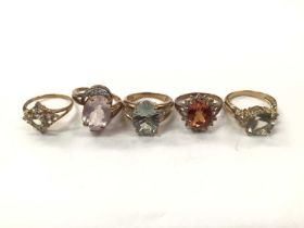 Five 9ct gold multi-gem set cocktail rings