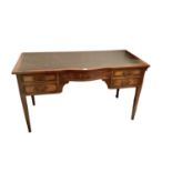 Edwardian mahogany writing table with five drawers and leather lined top