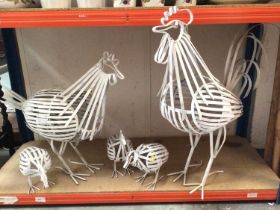 Painted metal work cockerel, hen and three chicks, together with two large wooden forks