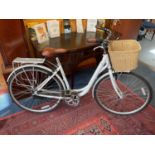 Ladies Raleigh Caprice bicycle with wicker basket and brown leather saddle