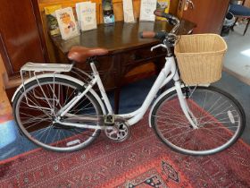 Ladies Raleigh Caprice bicycle with wicker basket and brown leather saddle