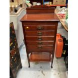 Edwardian mahogany music cabinet with ledge, five slides and undertier below