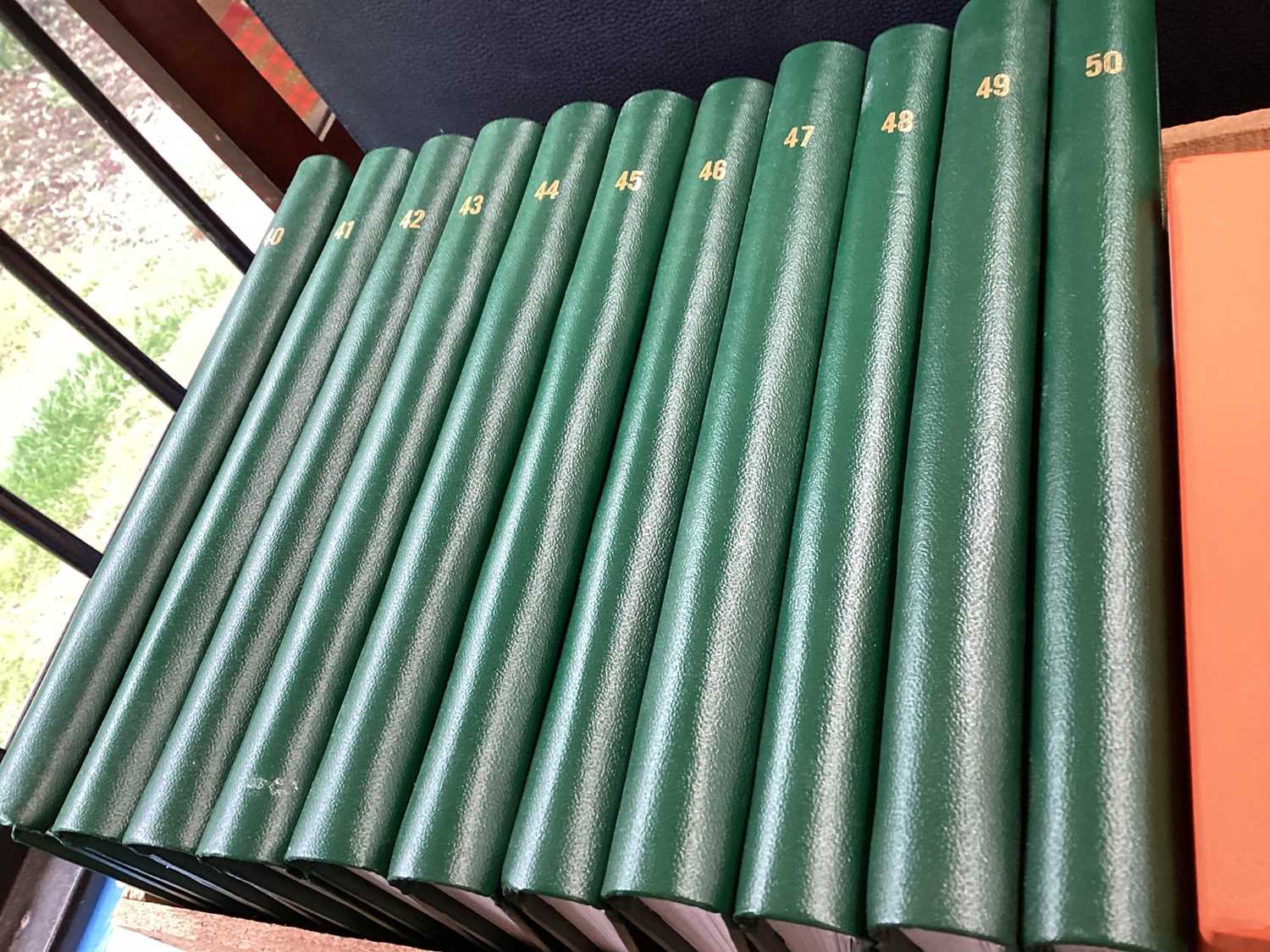 Eleven green bound albums (empty) and four leather photograph albums, boxed