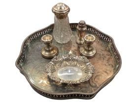 Pierced silver bon bon dish, pair of small silver candlesticks, silver pepper and a silver topped gl