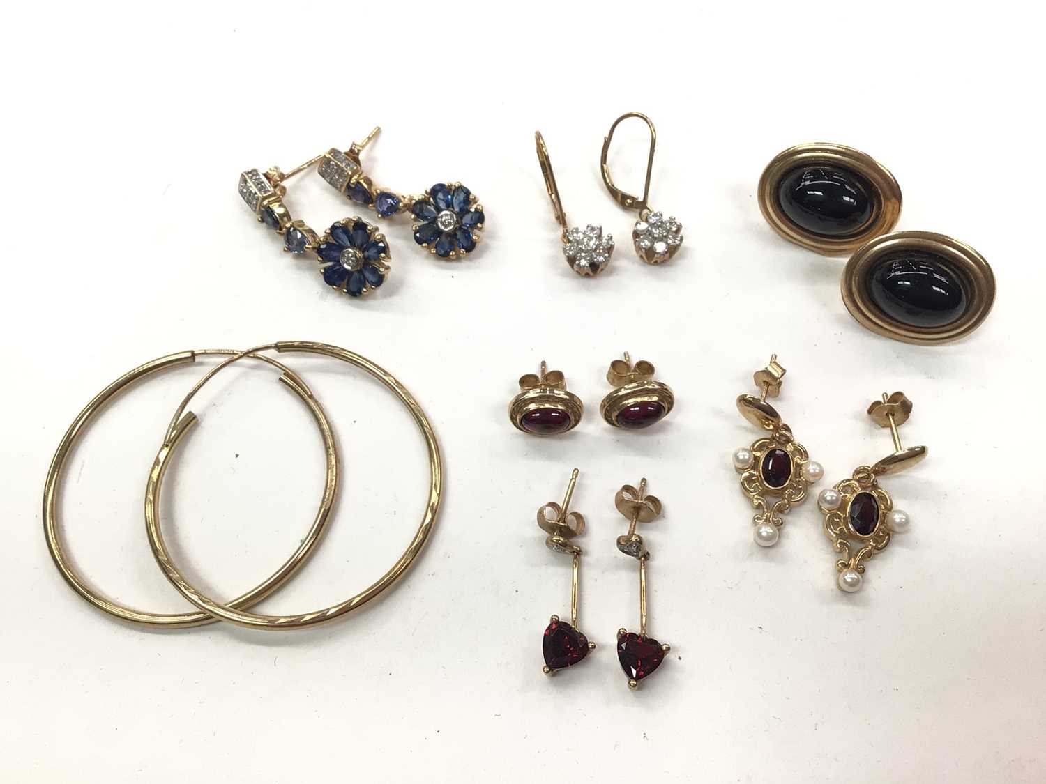 Six pairs of 9ct gold gem set earrings including a pair of diamond clusters