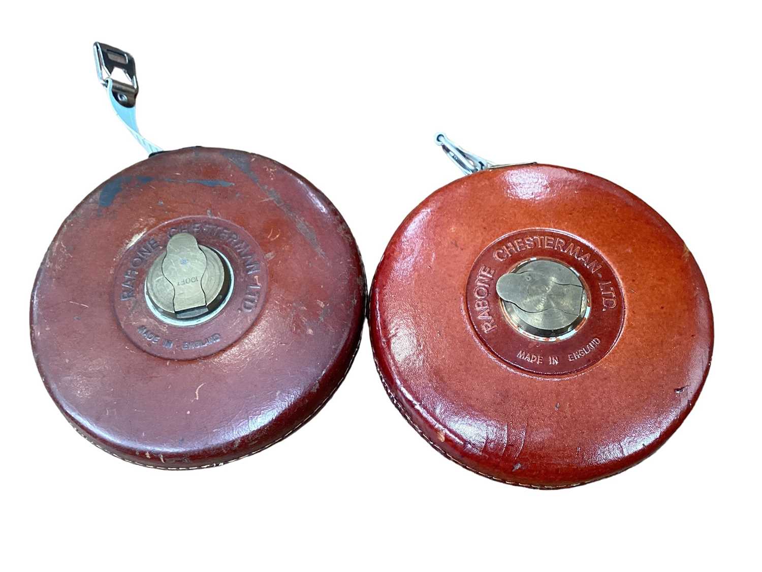 Two Rabone Chersterman Ltd leather bound tape measures, old telescope, reproduction barometer, tins,