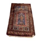 Eastern rug decorated with buildings on red, blue and brown ground, 128cm x 80cm