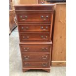 Reproduction narrow yew wood tallboy chest of six drawers