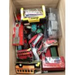 Box of cars and vehicles including die cast early Dinkys, boxed Corgi buses and others.