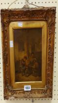 An ornate gilt gesso framed 19th Century oil on card, depicting seated figures in a tavern - 20cm