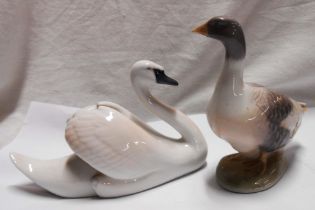 A Royal Copenhagen figurine depicting a swan - sold with a similar goose (a/f)