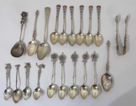 A set of six silver coffee spoons with decorative champleve enamelled terminals by Barker Brothers -