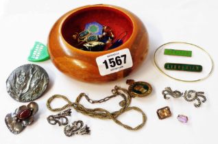 A wooden pot containing marked 'silver' earrings, costume, other jewellery and two loose stones