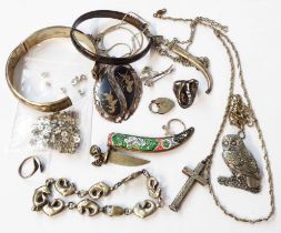 A bag containing a quantity of silver and white metal jewellery including Siam and enamelled