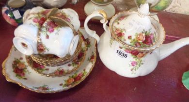 A Royal Albert Old Country Roses part tea set comprising teapot, four cups and saucers, three tea