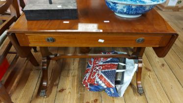 A 68cm reproduction mahogany and cross banded sofa table with frieze drawer, set on shaped