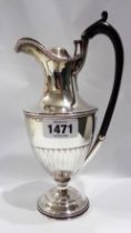 A 23.5cm high silver ewer jug with semi-fluted decoration - London 1896 - knop to hinged lid