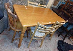 A 1.2m modern mixed A 1.2m modern mixed A 1.2m modern mixed wood kitchen table, set on turned legs -