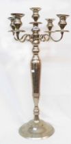 An 86.5cm high reproduction silver plated four branch five light candelabrum with slender baluster
